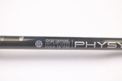 Close-up of a St. Croix Physyx PHXC76MHMF 7'6" Medium Heavy casting rod in mint condition, showing specifications and "Made in USA" with a small flag emblem. The words "PHYS" are partially visible, ideal for our Rod and Reel Trade-In Program to earn store credit on used gear.