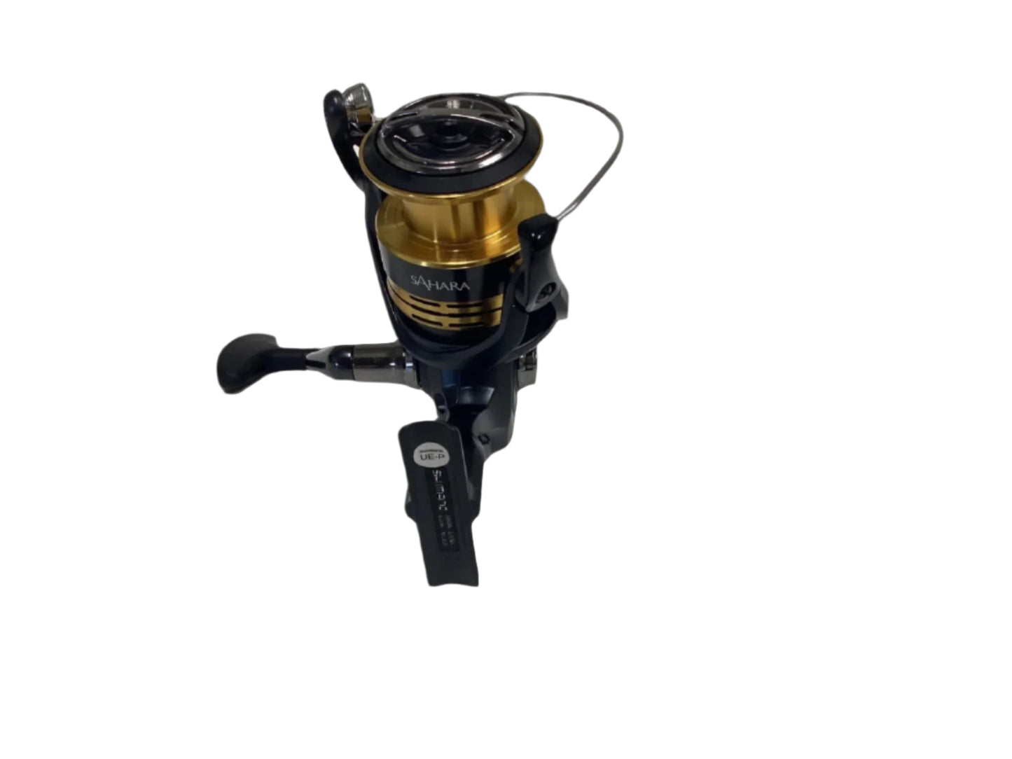 A close-up of a Shimano Sahara FJ SH4000XGFJ spinning reel featuring a golden spool and black body against a white background, ideal for rod and reel trade-in enthusiasts. The Shimano brand is visible on the side with the handle extending to the left.