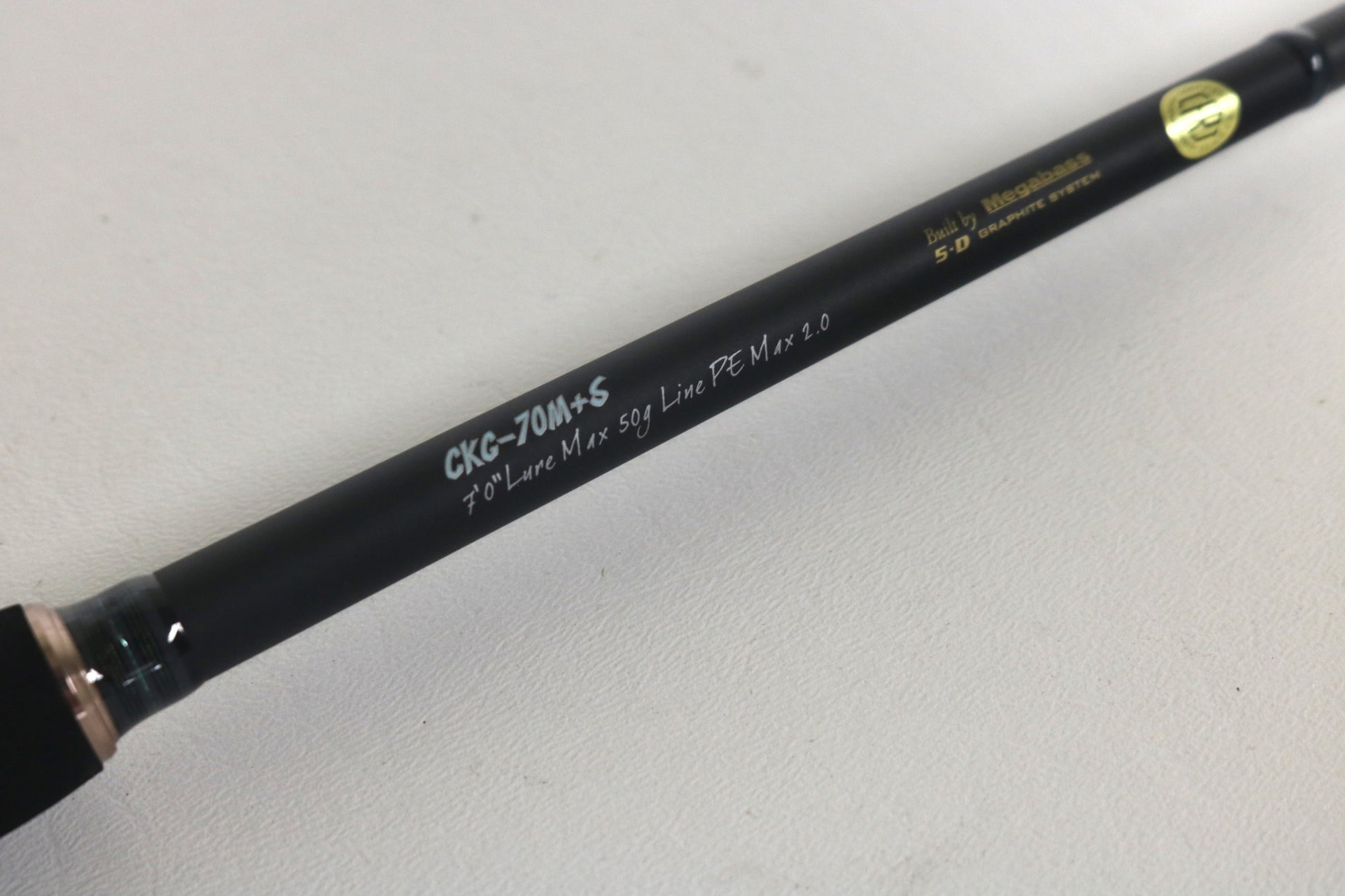 Close-up of the Megabass Cookai Gulf Inshore Spinning Rod - CKG72MS, showing its specifications on a light background. A great addition for collectors participating in our Rod and Reel Trade-In program.