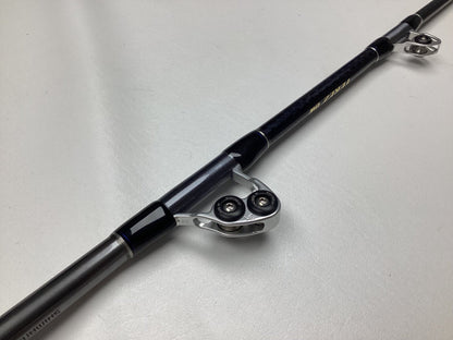 Close-up of a Shimano Terez BW Full Roller Uni Butt Rod 78" Heavy TZBW78HFRUBA, in mint condition. The sleek black and silver design with high-quality roller guides is part of the Rod and Reel Trade-In Program, showcased on a light surface to highlight its craftsmanship.