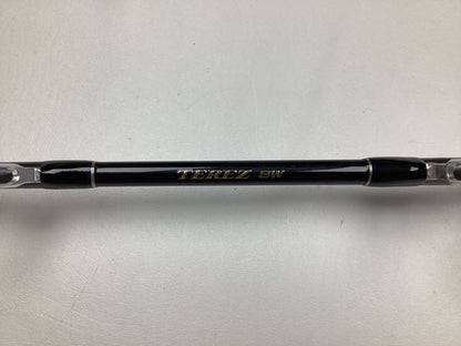 Close-up of a Shimano Terez BW Full Roller Uni Butt Rod, featuring a black body with metallic ends and "TEREZ BW" printed in gold. Ideal for our Rod and Reel Trade-In Program, providing store credit based on gear condition. Set against a plain white background.