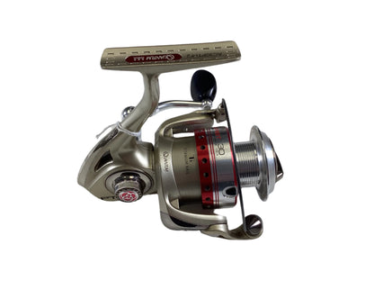 The Quantum Accurist 30 AC30PTI-F2, a modern compact reel in very good condition, features a metallic finish with red and black accents and a side handle. Its numbered spool ensures precise measurements. Trade in used gear through our Nation's Best Rod and Reel Trade-In Program for store credit.