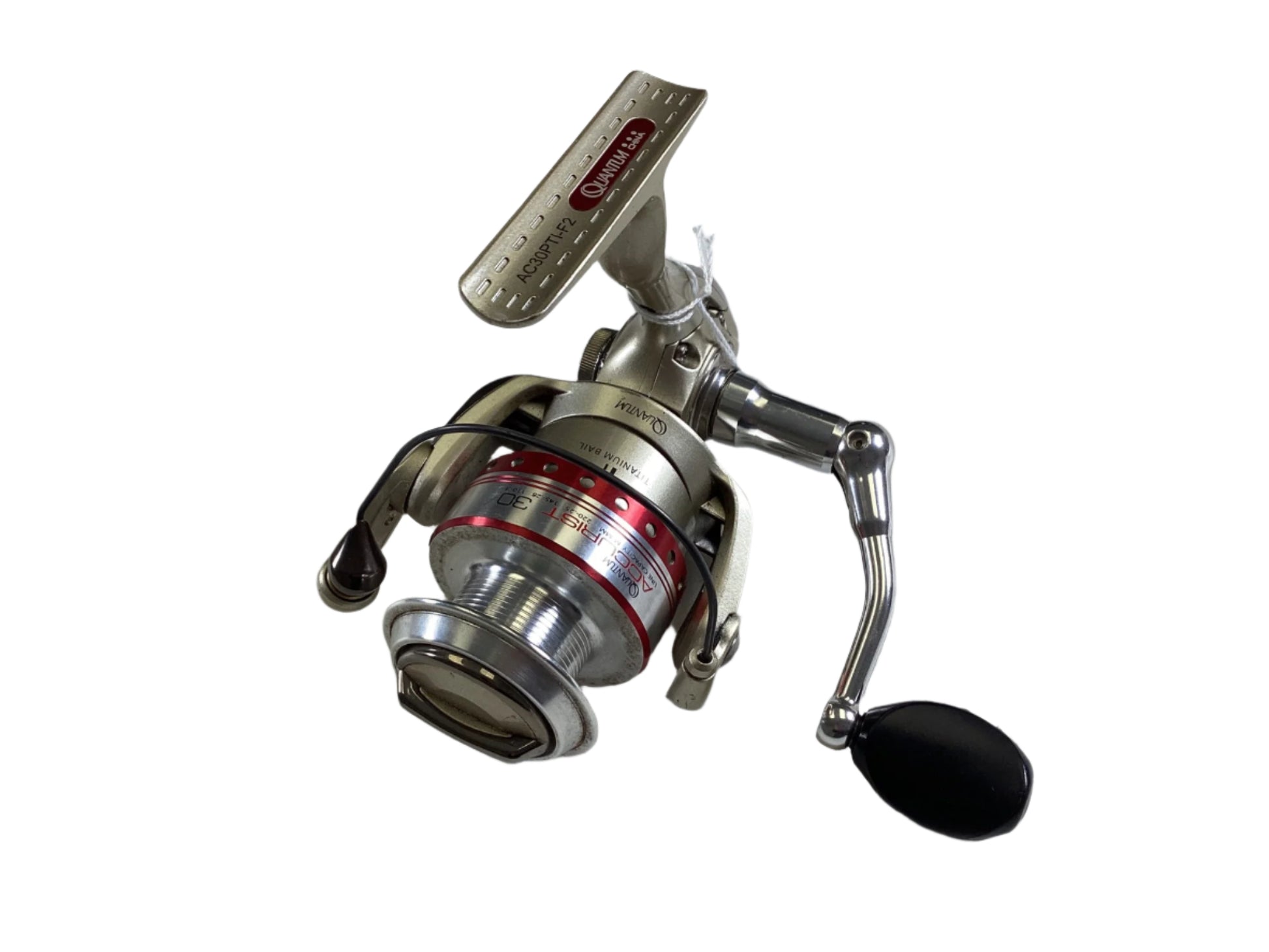 Close-up of a silver Quantum Accurist 30 AC30PTI-F2 spinning reel featuring a black handle and red accents on white. Eligible for the Nation's Best Rod and Reel Trade-In Program, it proudly shows its brand name and model number.