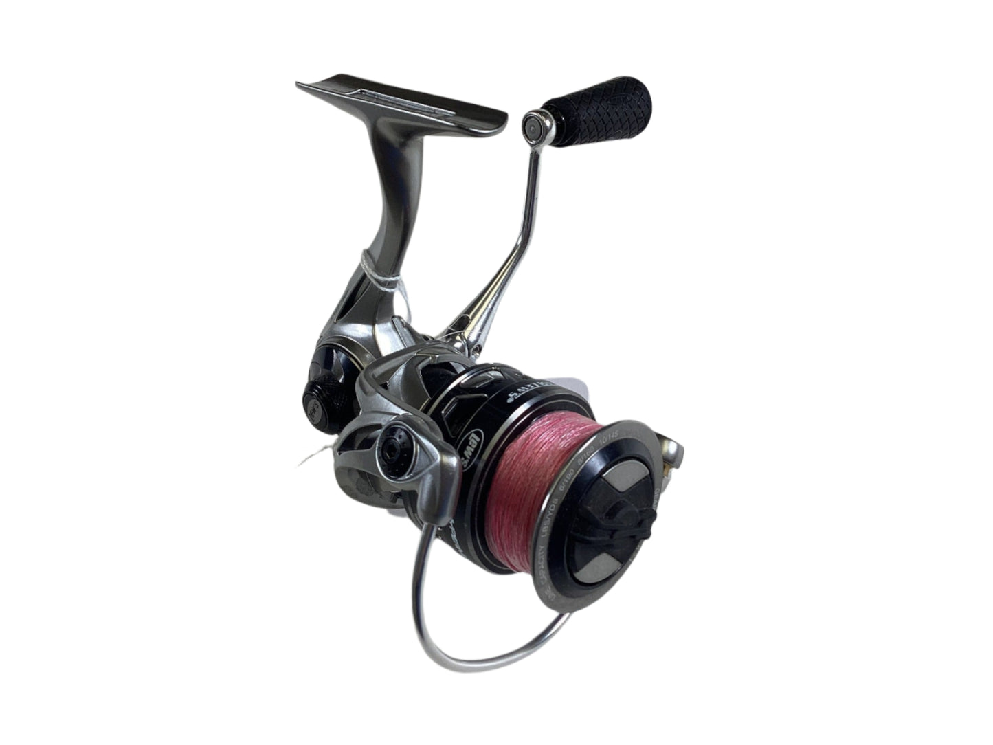 The Lew's HyperMag HMS200, a silver and black used spinning reel in very good condition with a pink line, features a sleek design and a textured curved handle. It's elegantly isolated on white, ready for your next Rod and Reel Trade-In.