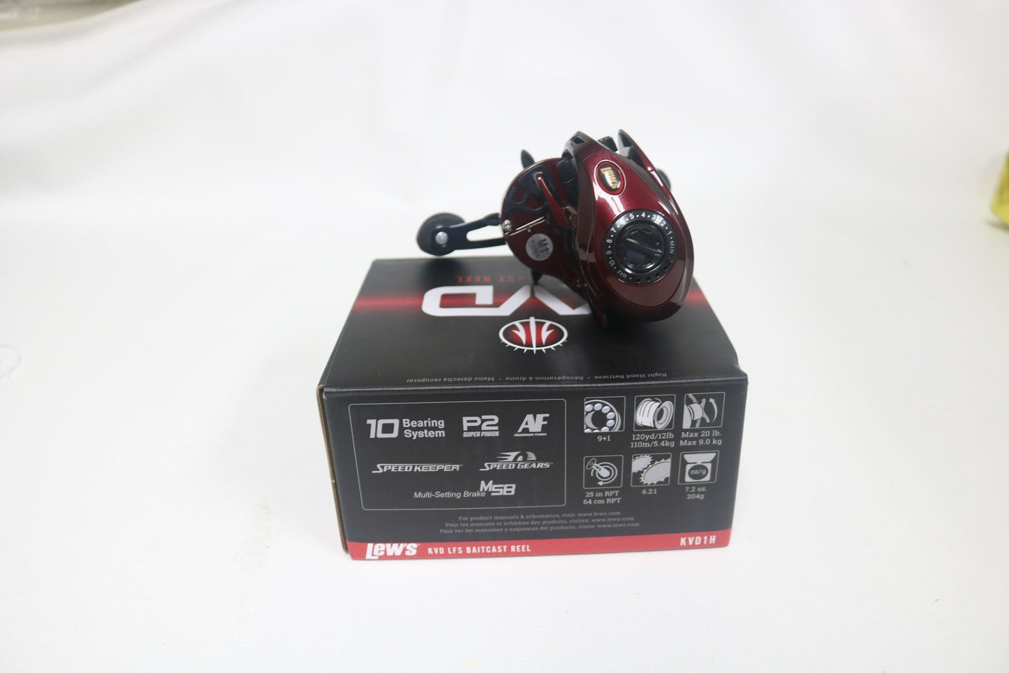 A used Lew's KVD1H 6.2:1 right-hand casting reel, in very good condition, sits on its black and red box against a white background. It's ideal for participants in the Rod and Reel Trade-In Program looking for gear upgrades, featuring a 10-bearing system.