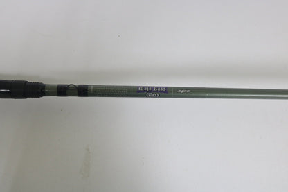 The St. Croix Mojo Bass MGC72MM, a used casting rod in excellent condition, features a black handle and grey shaft with "Mojo Bass Glass" and "IPC Technology" text. Ideal for upgrading through our Rod and Reel Trade-In Program for valuable store credit.