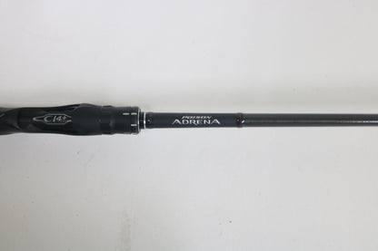 A close-up of a Shimano Poison Adrena PAD1610MGA 6'10" Medium Glass used casting rod features "Poison Adrena" and a black handle with "CI4+" in silver. In excellent condition, this rod is ideal for the Rod and Reel Trade-In Program to earn store credit.