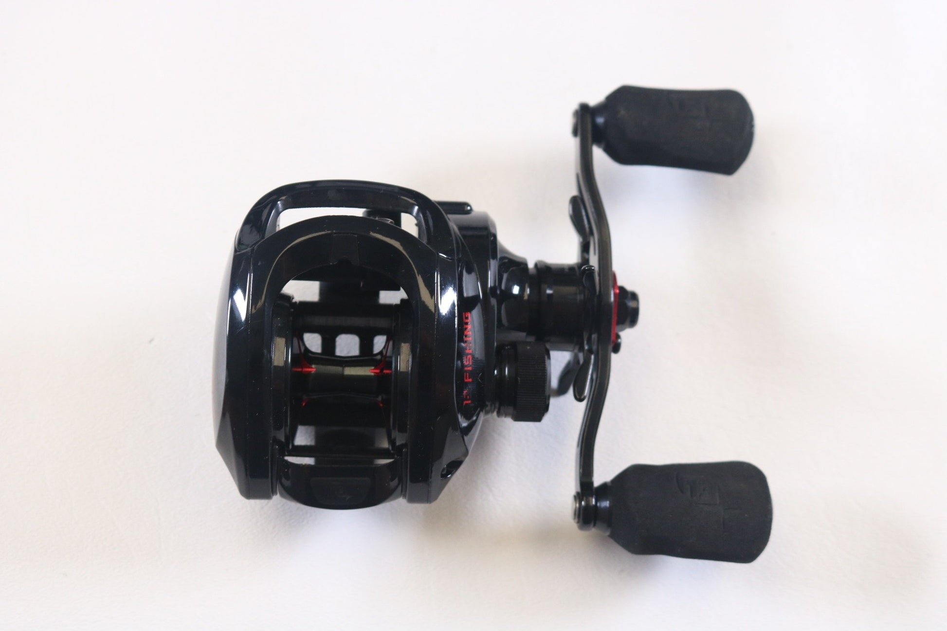 Upgrade your fishing gear with the used 13 Fishing Inception G2P Casting Reel, featuring a sleek black design with red accents and dual handles. Trade in your old equipment through the Nation's Best Rod and Reel Trade-In Program to earn store credit.