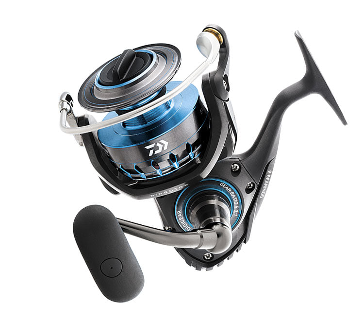 The Daiwa Saltist Heavy Action 5.6:1 Spinning Reel, also known as SALTIST2500, is a sleek reel featuring a black and metallic blue finish, Magsealed technology, a balanced handle and spool, with brand markings on the body for smooth casting and retrieval in fishing activities.