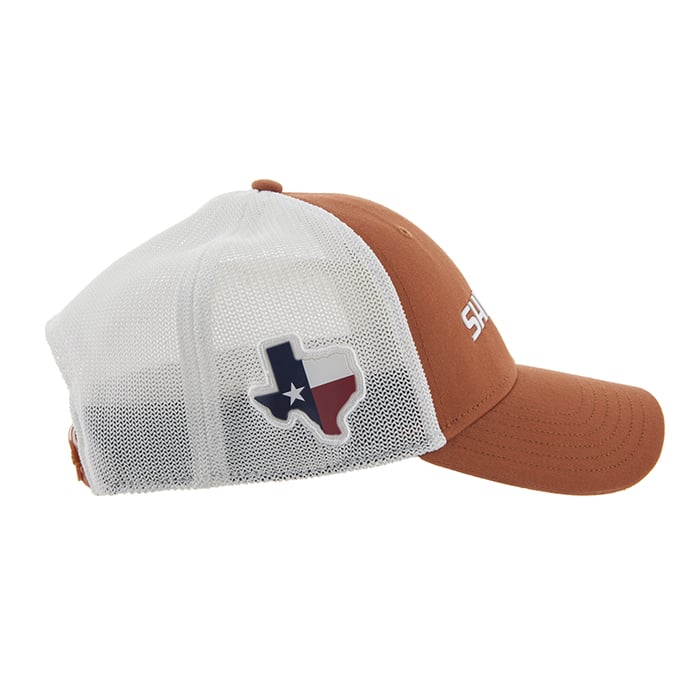 The Shimano Texas State Redfish Cap is a performance trucker hat featuring a brown front and brim, white mesh back, and a Texas state logo with flag design on the side. "SA" text is partially visible on the front—ideal for fans of the Shimano Texas Redfish Cap collection.