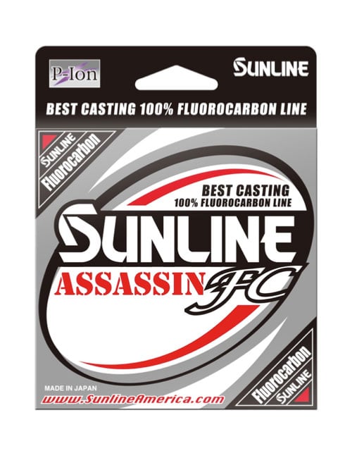 The Sunline Assassin FC 225yd packaging features a striking silver, black, red, and white design with the "Best Casting 100% Fluorocarbon Line" text. It includes the P-Ion logo and is made in Japan, showcasing advanced Pion Technology for superior abrasion resistance.