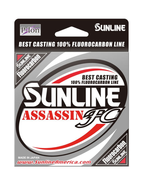 Sunline Assassin FC 225yd, a Japanese-made 100% fluorocarbon fishing line enhanced with Pion Technology, features bold text in a sleek silver and red design emphasizing "Best Casting" and abrasion resistance. The packaging includes the Sunline logo and website.