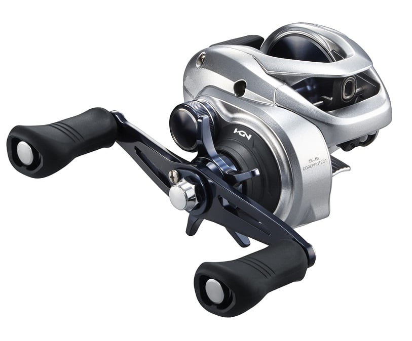 The Shimano Tranx 400 5.8:1 Casting Reel (TRX400A) from americanlegacyfishing boasts a sleek silver and black design with ergonomic handles, CoreProtect technology, and adjustable knobs and dials, making it ideal for fishing enthusiasts seeking control and grip.